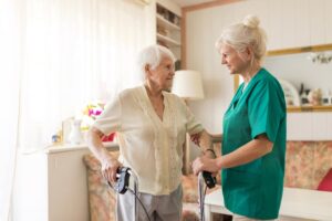 Caregiver and senior patient at home